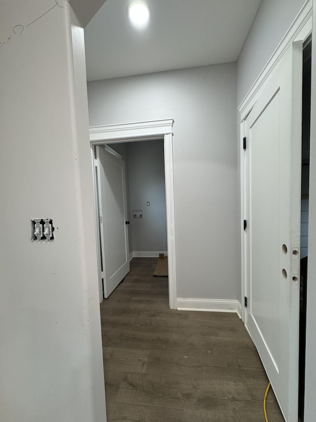 hallway with dark hardwood / wood-style flooring