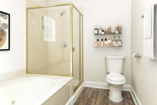 bathroom featuring independent shower and bath, hardwood / wood-style floors, and toilet