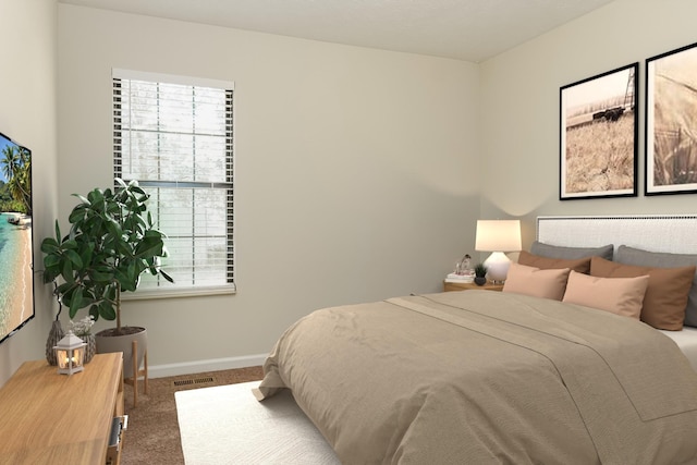 bedroom with multiple windows and carpet floors