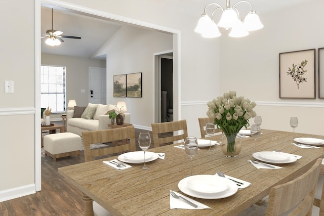 dining space featuring vaulted ceiling, dark hardwood / wood-style floors, and ceiling fan with notable chandelier