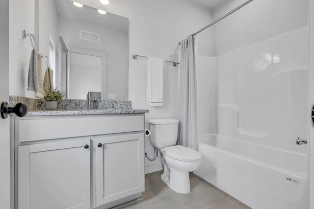 full bathroom featuring vanity, toilet, and shower / bath combo