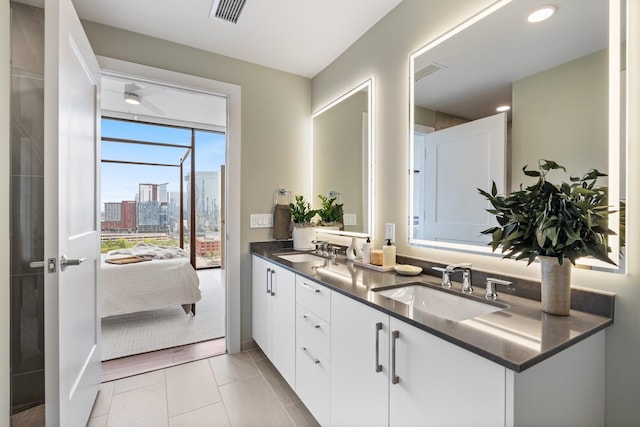 bathroom with vanity and tile patterned floors