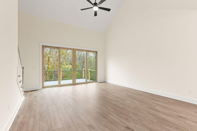 interior space featuring ceiling fan, high vaulted ceiling, and light wood-type flooring