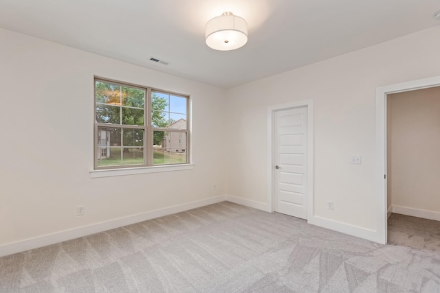 unfurnished bedroom with light carpet