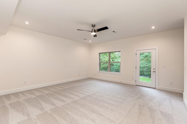 carpeted empty room featuring ceiling fan