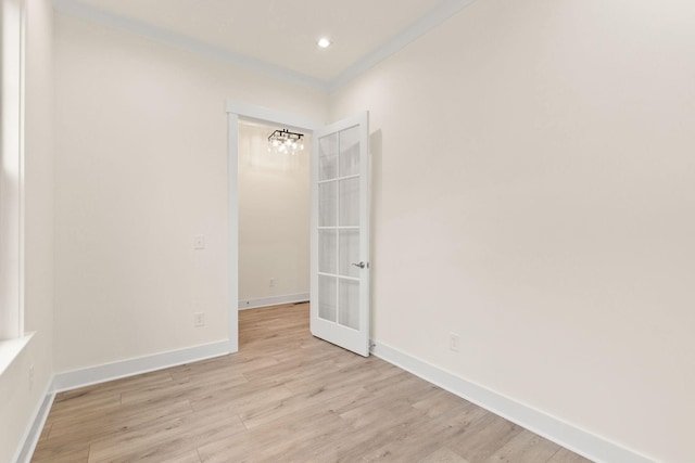 unfurnished room featuring crown molding and light hardwood / wood-style flooring