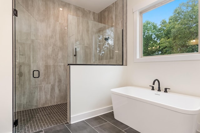 bathroom with tile patterned flooring and independent shower and bath