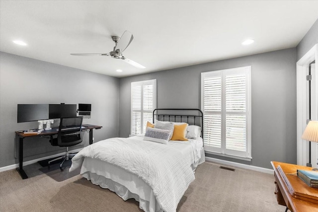 bedroom featuring ceiling fan and light carpet