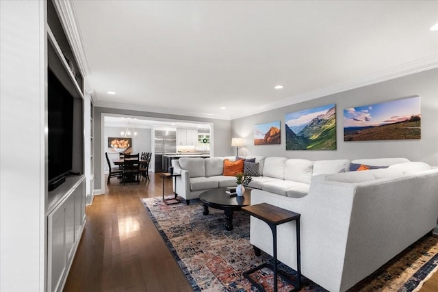 living room with crown molding, a notable chandelier, and dark hardwood / wood-style flooring