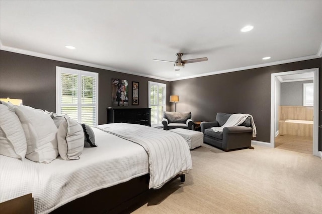 bedroom with crown molding, ceiling fan, connected bathroom, and light carpet