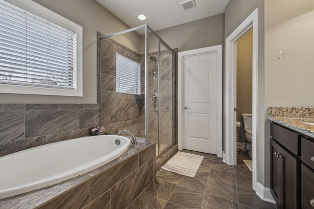 full bathroom with vanity, independent shower and bath, and toilet