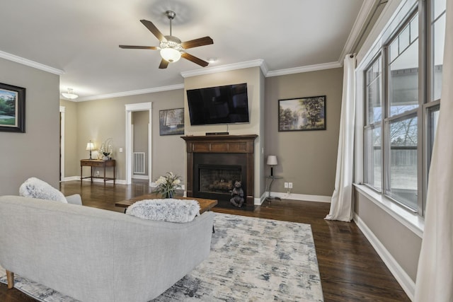 living room featuring crown molding, dark hardwood / wood-style floors, and ceiling fan