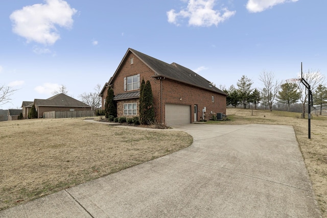 view of home's exterior with a yard, a garage, and central AC unit