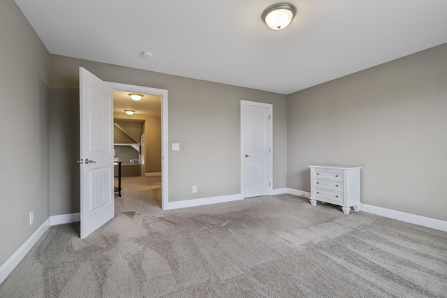 unfurnished bedroom with light colored carpet