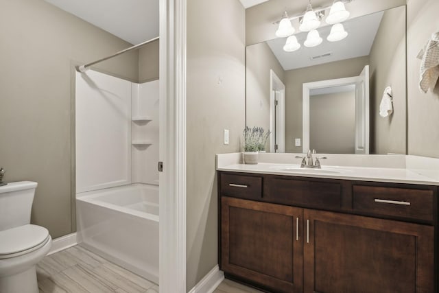 full bathroom with toilet, wood-type flooring, vanity, and  shower combination