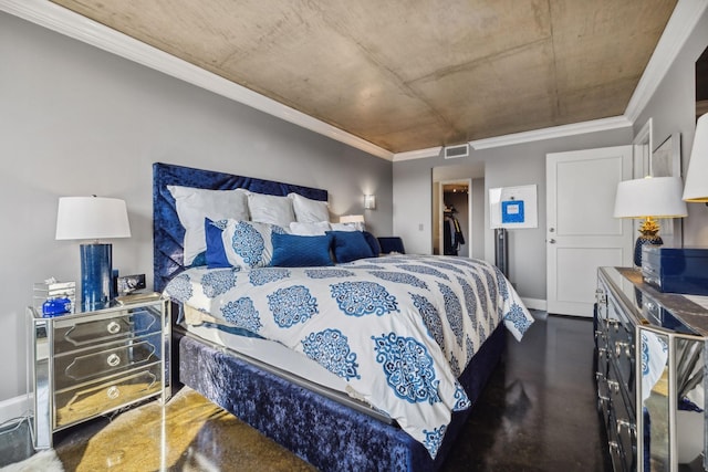 bedroom with crown molding, a spacious closet, and a closet