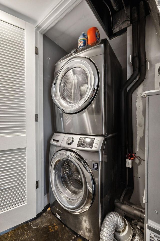 washroom with stacked washer and dryer