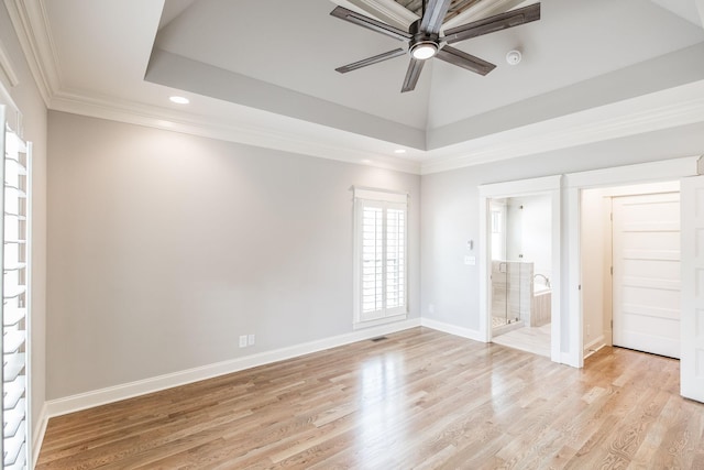 unfurnished bedroom with light wood finished floors, baseboards, visible vents, a tray ceiling, and recessed lighting