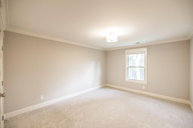 spare room with light carpet, visible vents, and baseboards