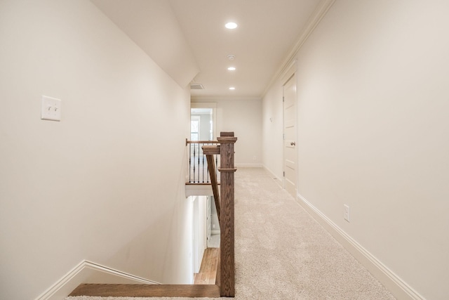 hallway featuring recessed lighting, carpet flooring, an upstairs landing, and baseboards