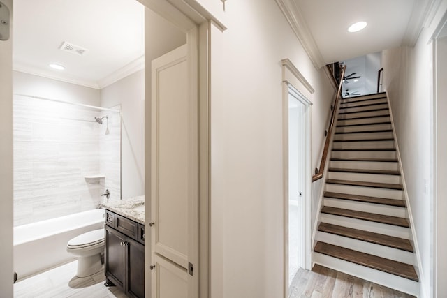 interior space with recessed lighting, visible vents, and crown molding