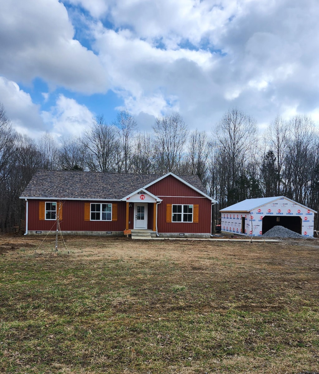 ranch-style house with a garage and a front yard