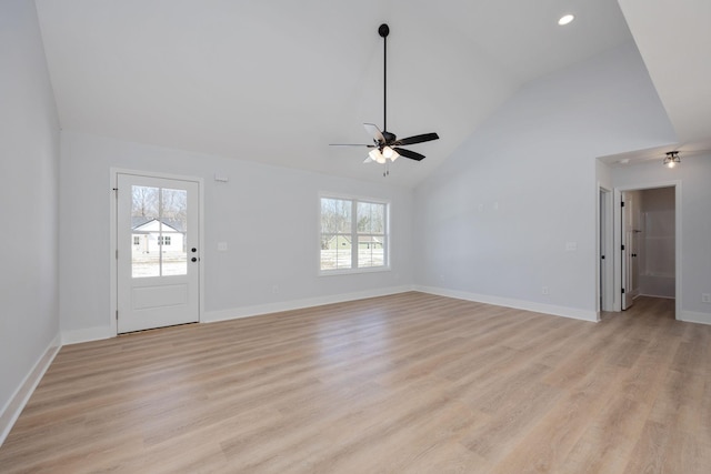 unfurnished living room with ceiling fan, high vaulted ceiling, recessed lighting, baseboards, and light wood-type flooring
