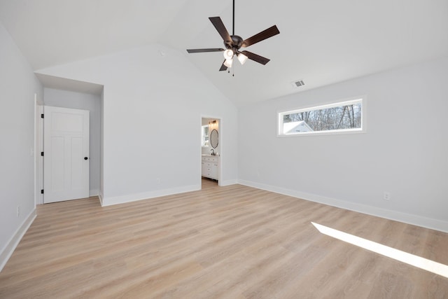 unfurnished bedroom featuring connected bathroom, baseboards, visible vents, and light wood finished floors