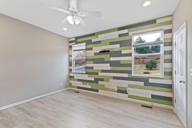 empty room featuring light hardwood / wood-style floors and ceiling fan