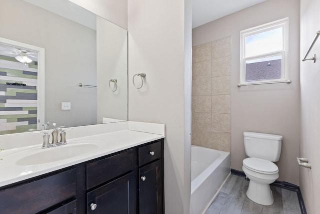 full bathroom with hardwood / wood-style flooring, vanity, toilet, and bathing tub / shower combination