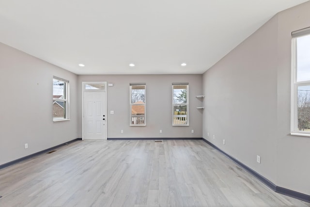 interior space featuring a wealth of natural light and light hardwood / wood-style floors