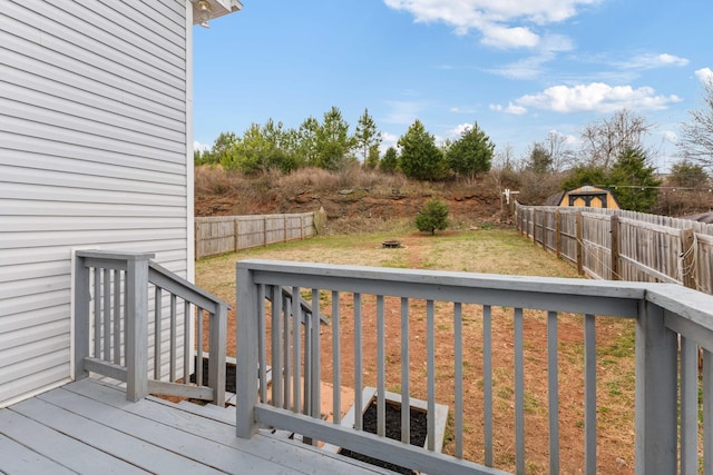 wooden terrace with a lawn