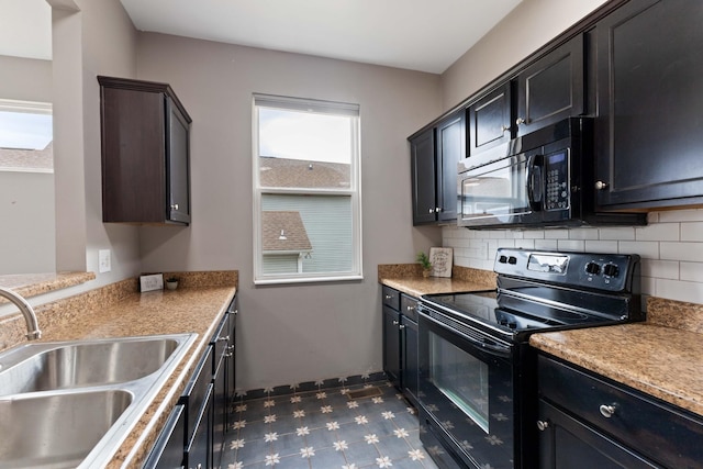 kitchen featuring sink, decorative backsplash, and black appliances