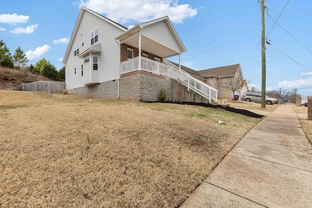 view of home's exterior with a lawn