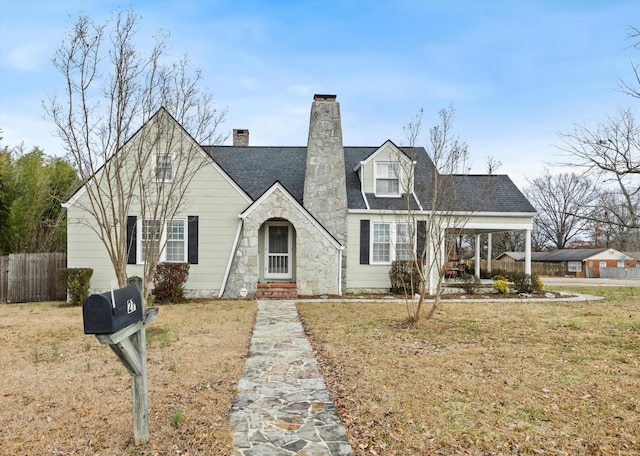 new england style home with a front yard