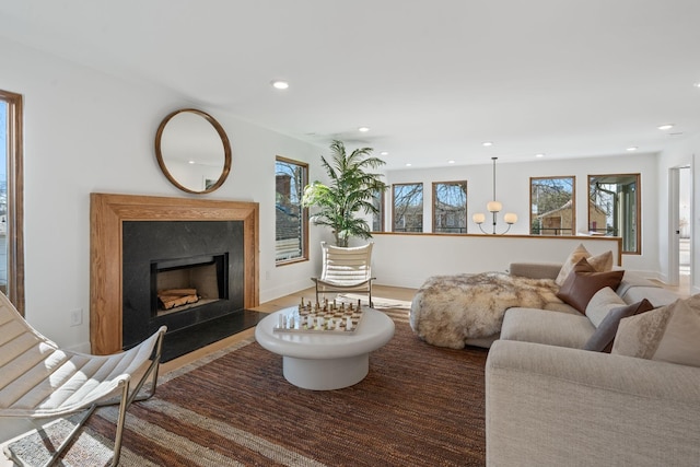 living room featuring dark wood-type flooring and a fireplace