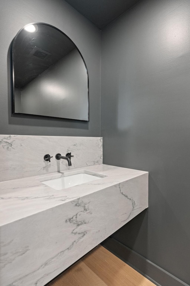 bathroom featuring vanity and hardwood / wood-style floors