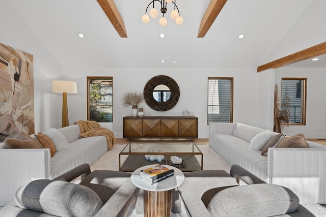 living room featuring an inviting chandelier and vaulted ceiling with beams