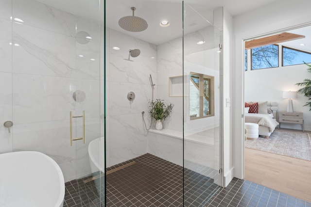 bathroom with wood-type flooring and separate shower and tub