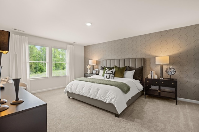 bedroom featuring light colored carpet