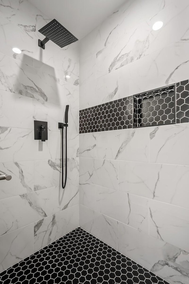 full bathroom with tiled shower