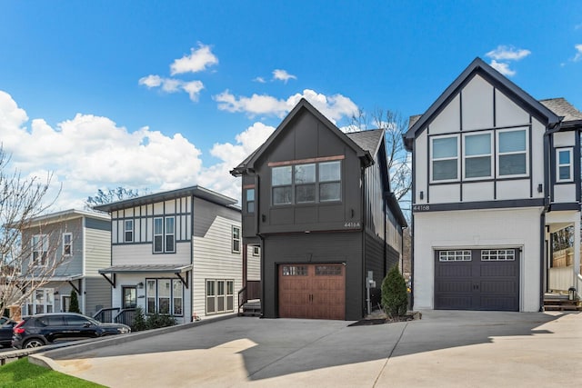 view of front facade featuring driveway, board and batten siding, and an attached garage