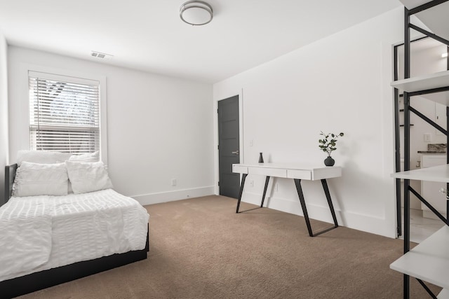 carpeted bedroom featuring visible vents and baseboards