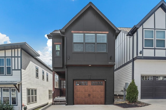 view of front of house with concrete driveway, brick siding, and an attached garage