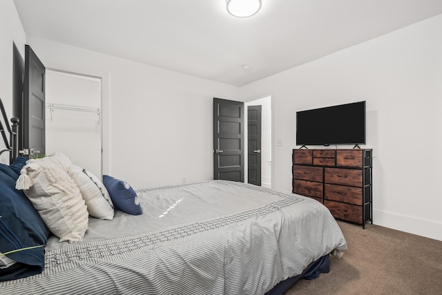 carpeted bedroom with baseboards