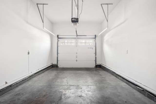 garage featuring baseboards and a garage door opener