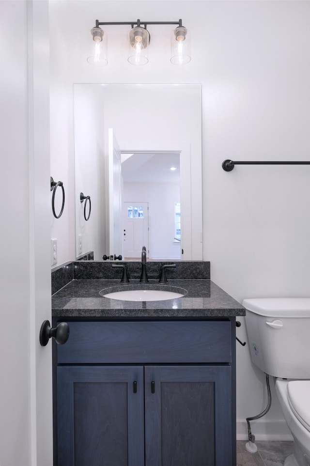 bathroom with vanity and toilet