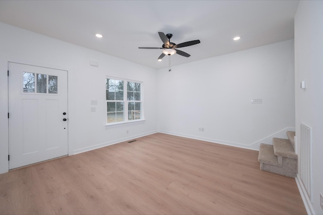 entryway with ceiling fan and light wood-type flooring