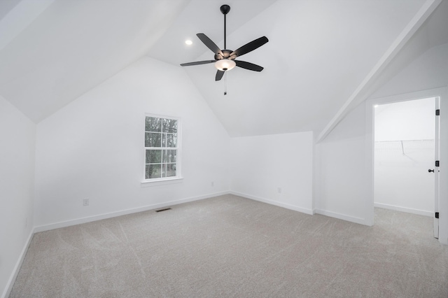 bonus room featuring vaulted ceiling, light colored carpet, and ceiling fan