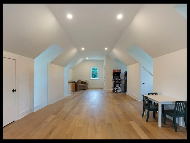 bonus room with vaulted ceiling, recessed lighting, and light wood-style floors